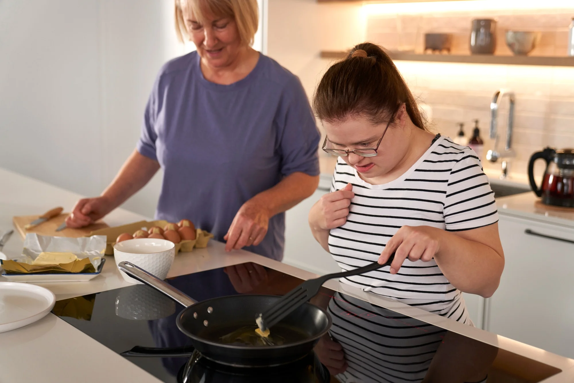 Support worker helping with cooking